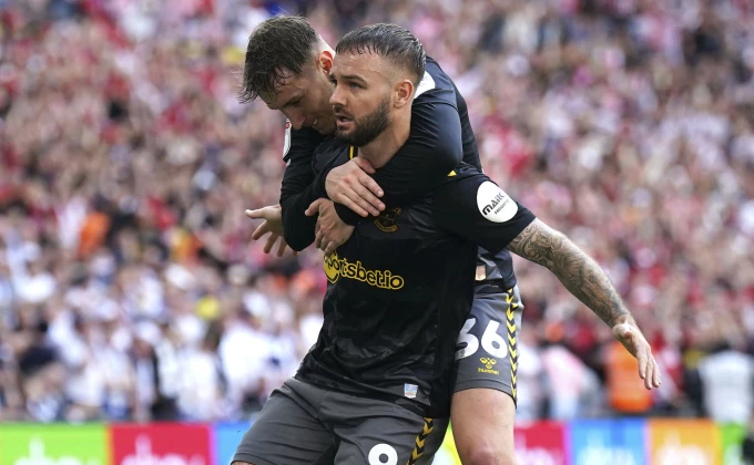 Adam Davy/PA via AP)